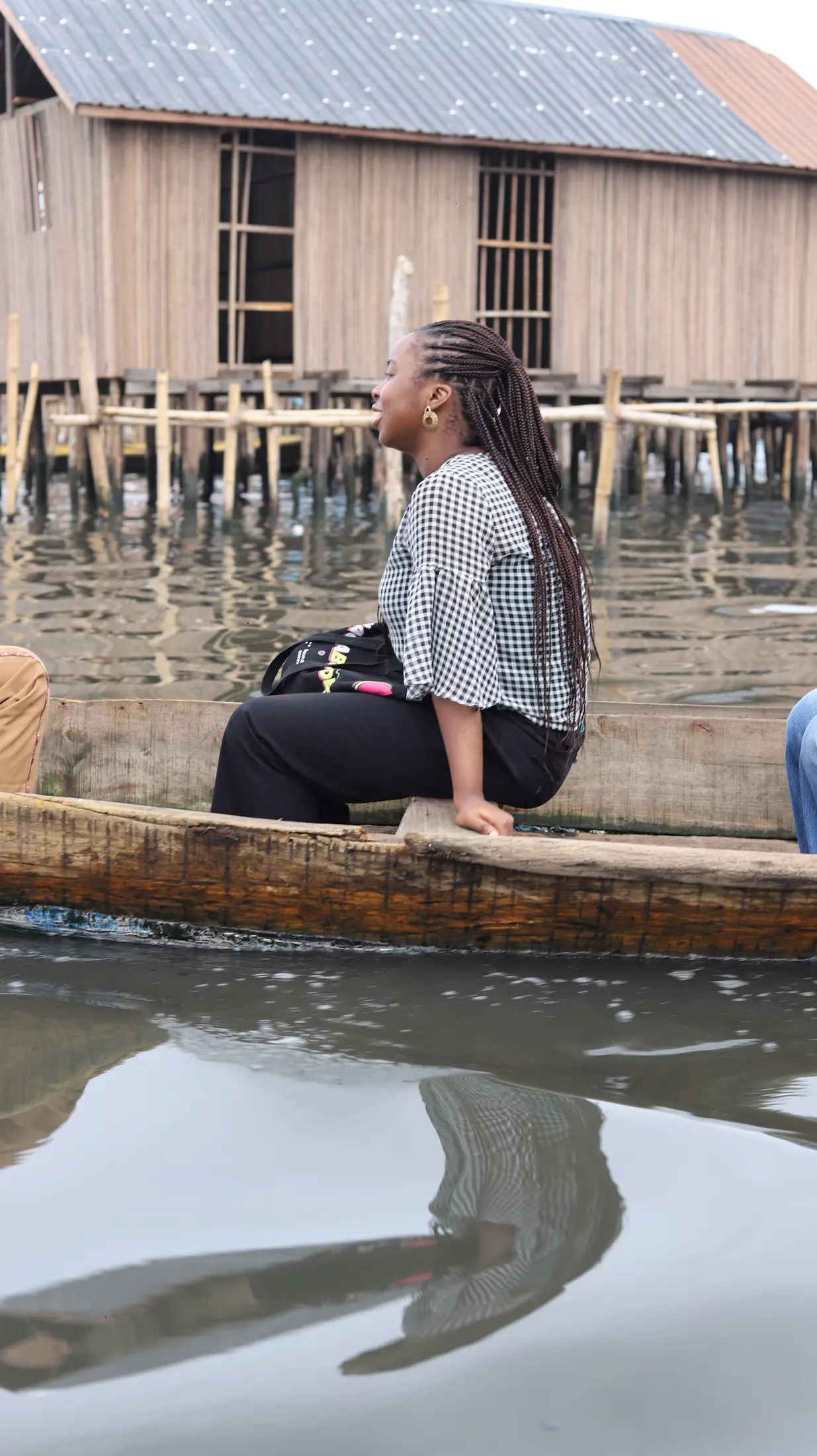 A young person standing beside the Makoko waterfront