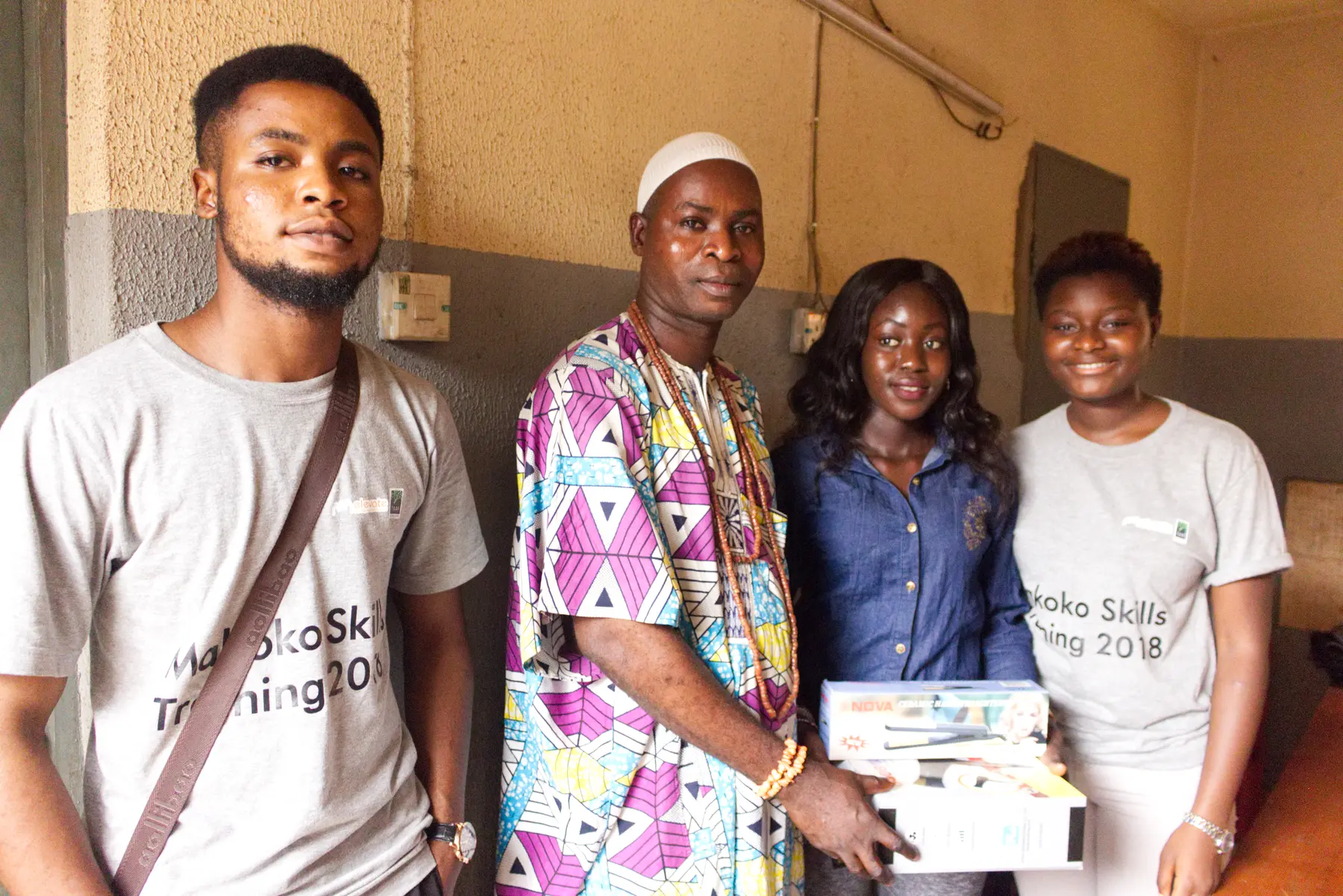 Participants holding certificates after a skills programme